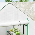 Outsunny Begehbares Gewächshaus mit 3 Etagen 8 Ablagen, kleines Gewächshaus mit verstärkter PE-Abdeckung, Gartenpflanzengewächshaus mit Rolltür und drei Gitterfenstern, 140 x 143 x 190 cm, Weiß - Thumbnail 9